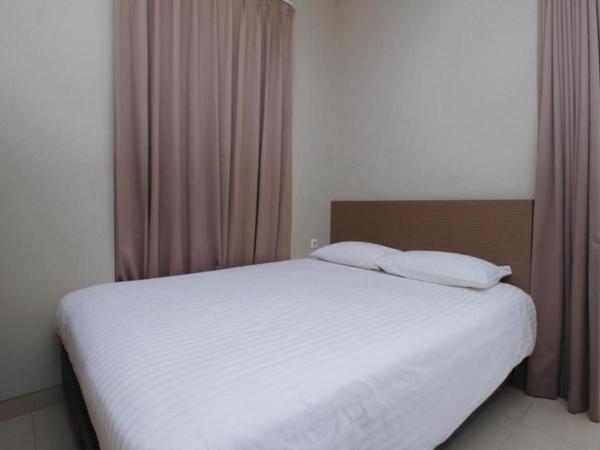 Home 899 Patal Senayan : photo 7 de la chambre chambre lits jumeaux standard
