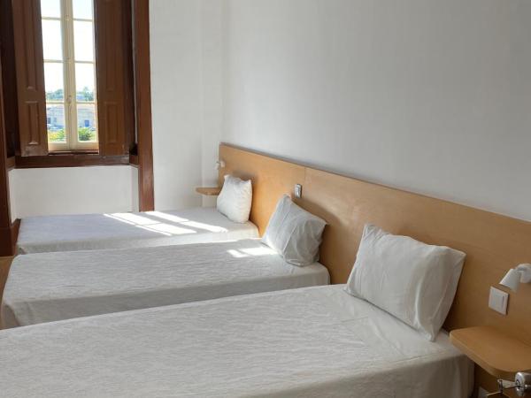 Guesthouse Lusa Atenas : photo 1 de la chambre chambre triple