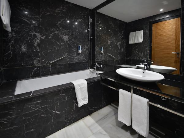 Le Yacht Suites Hotel : photo 3 de la chambre petite chambre double