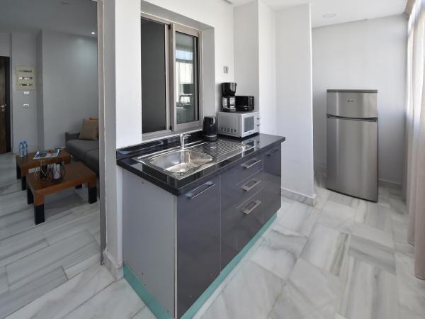 Le Yacht Suites Hotel : photo 4 de la chambre appartement - vue sur jardin