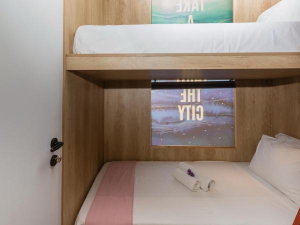 LOC HOSPITALITY Urban Den : photo 5 de la chambre petite chambre lits jumeaux