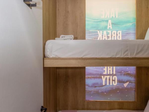 LOC HOSPITALITY Urban Den : photo 8 de la chambre petite chambre lits jumeaux