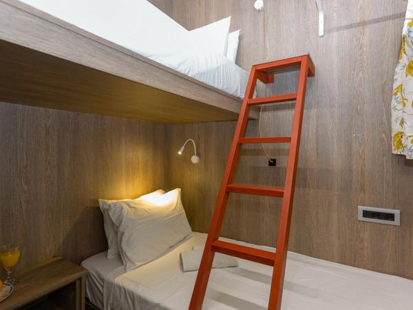 LOC HOSPITALITY Urban Den : photo 4 de la chambre petite chambre lits jumeaux