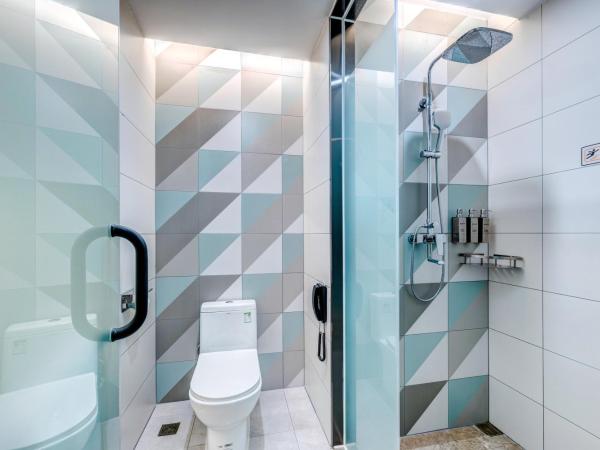 Happy Dragon City Culture Hotel-Tianjin Draum Tower & Dayuecheng shopping mall : photo 6 de la chambre chambre lits jumeaux avec salle de bains privative