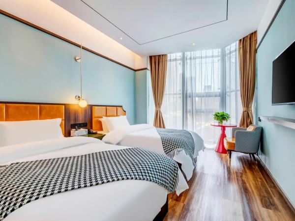 Happy Dragon City Culture Hotel-Tianjin Draum Tower & Dayuecheng shopping mall : photo 2 de la chambre chambre lits jumeaux avec salle de bains privative