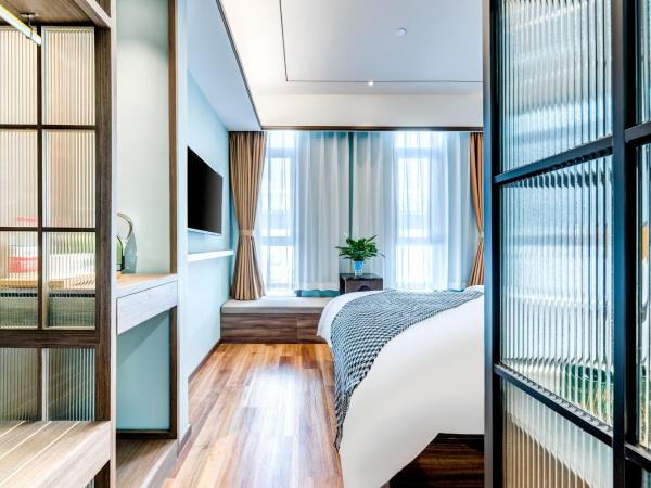 Happy Dragon City Culture Hotel-Tianjin Draum Tower & Dayuecheng shopping mall : photo 1 de la chambre chambre double avec salle de bains privative