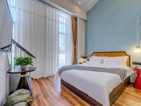 Happy Dragon City Culture Hotel-Tianjin Draum Tower & Dayuecheng shopping mall : photo 5 de la chambre chambre familiale avec salle de bains privative