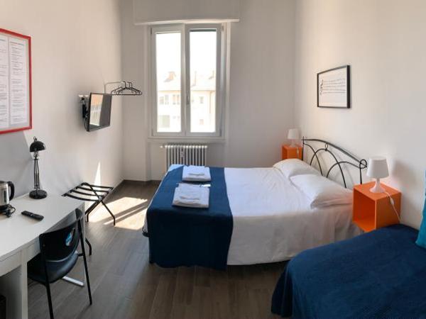 Mambo Suites : photo 1 de la chambre chambre double deluxe avec lit d'appoint