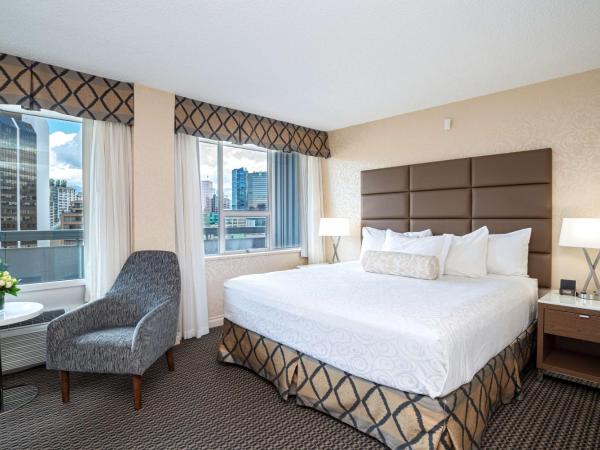 Best Western Premier Chateau Granville Hotel & Suites & Conference Centre : photo 1 de la chambre chambre exécutive lit king-size avec balcon - non-fumeurs