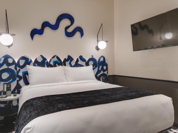 Naumi Studio Wellington : photo 3 de la chambre hébergement lit queen-size zing
