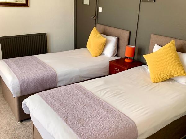 Manchester Stay Hotel - Free Parking : photo 1 de la chambre chambre lits jumeaux avec salle de bains externe