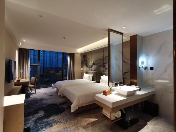 Paco Hotel Jinfeng Metro Guangzhou - Free Shuttle Bus For Canton Fair : photo 4 de la chambre chambre lits jumeaux deluxe