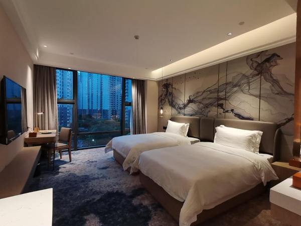 Paco Hotel Jinfeng Metro Guangzhou - Free Shuttle Bus For Canton Fair : photo 1 de la chambre chambre lits jumeaux deluxe