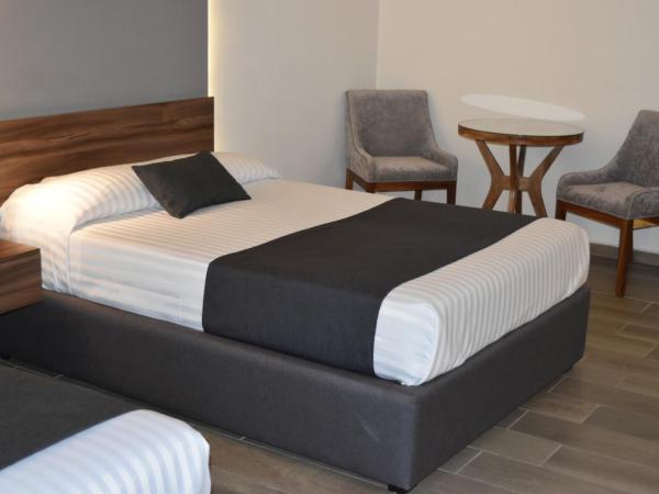 Estanza Hotel & Suites : photo 2 de la chambre chambre lits jumeaux