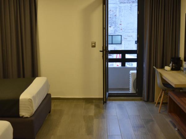 Estanza Hotel & Suites : photo 9 de la chambre chambre lits jumeaux