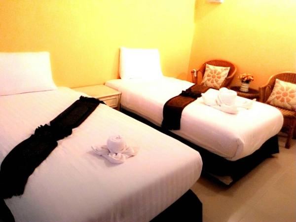 Ploy Puu Residence : photo 1 de la chambre chambre lits jumeaux standard