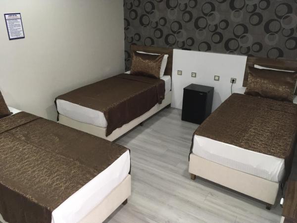 Petrol-İş İstanbul Misafirhanesi : photo 3 de la chambre chambre lits jumeaux avec lit d’appoint - 301