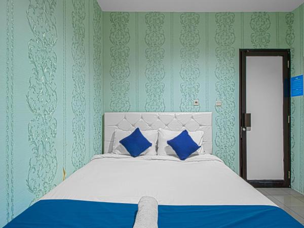 Bungur Inn Syariah : photo 1 de la chambre chambre double deluxe