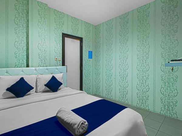 Bungur Inn Syariah : photo 1 de la chambre chambre lit queen-size