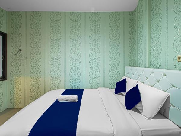 Bungur Inn Syariah : photo 2 de la chambre chambre lit queen-size