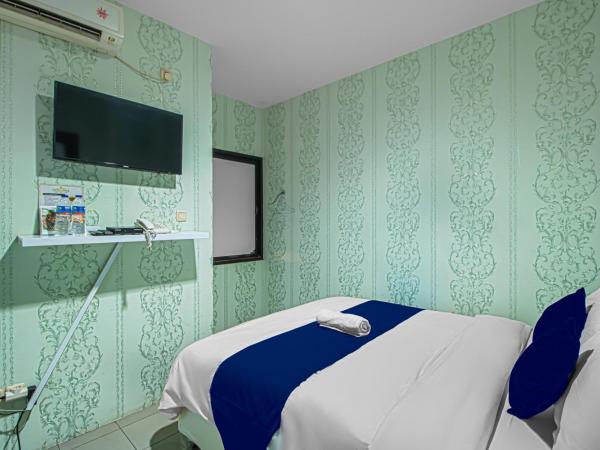 Bungur Inn Syariah : photo 5 de la chambre chambre lit queen-size