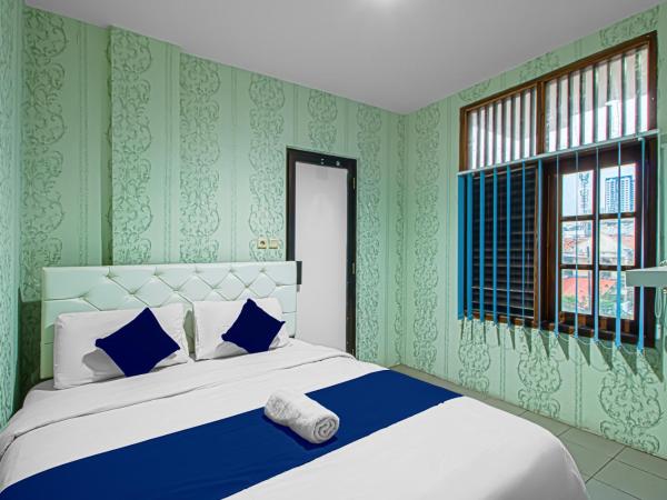 Bungur Inn Syariah : photo 4 de la chambre chambre lit queen-size