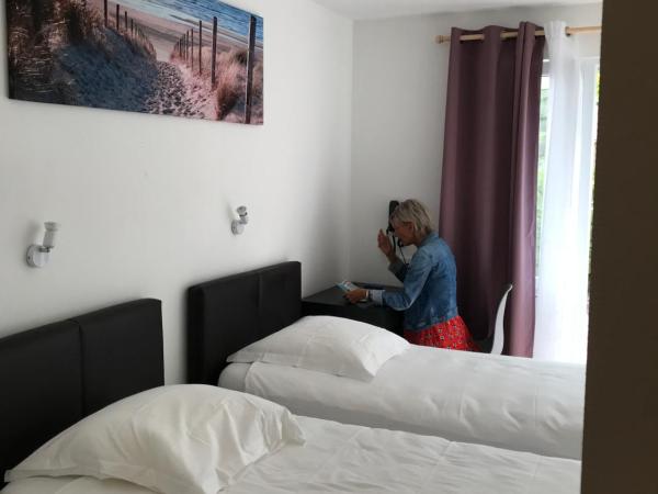 Reingam-Park : photo 3 de la chambre chambre lits jumeaux avec salle de bains