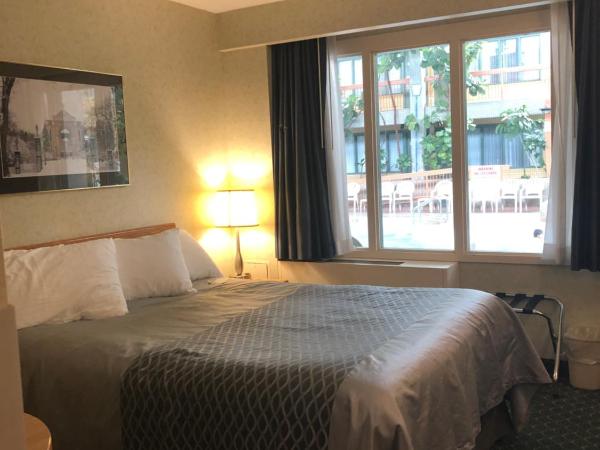 Travelodge by Wyndham Winnipeg East : photo 3 de la chambre chambre lit queen-size deluxe - non-fumeurs