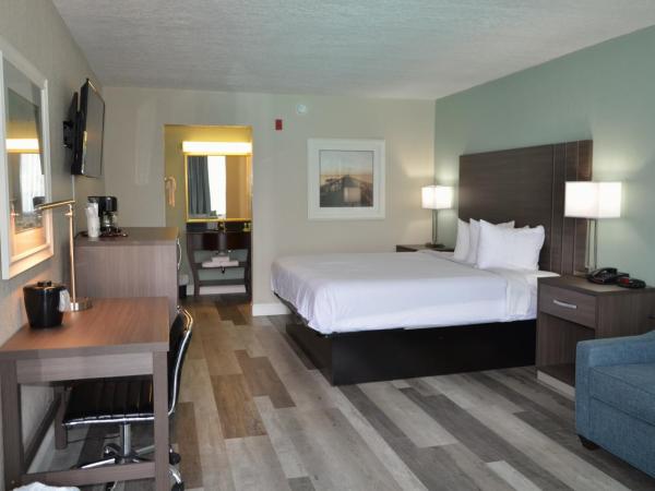 Opal Hotel & Suites : photo 1 de la chambre hébergement lit king-size rénové - vue sur piscine