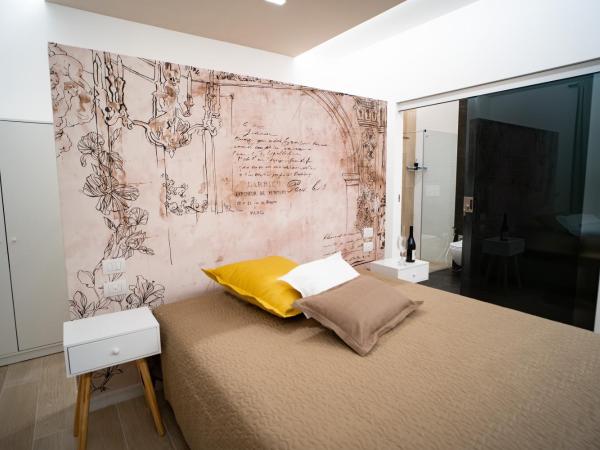 L' Angolo dei poeti - Bed and Breakfast : photo 5 de la chambre chambre familiale avec salle de bains privative