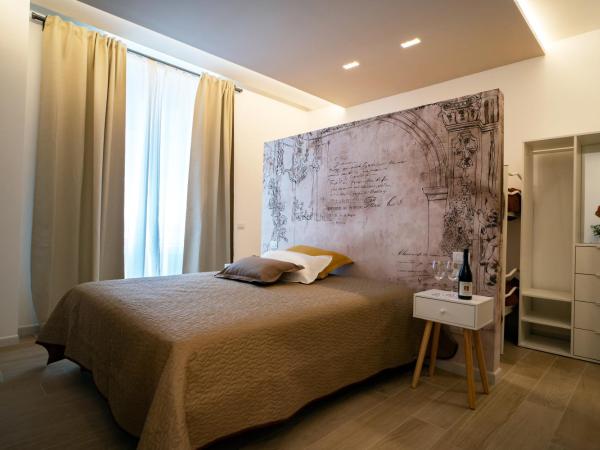 L' Angolo dei poeti - Bed and Breakfast : photo 2 de la chambre chambre familiale avec salle de bains privative