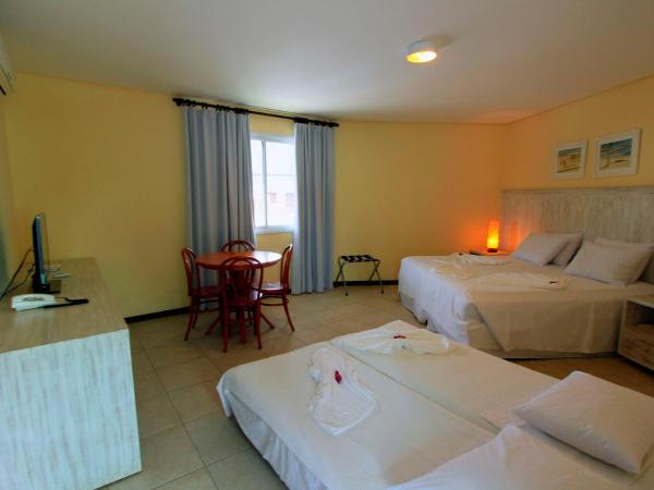 Farol de Itapuã Praia Hotel : photo 1 de la chambre chambre quadruple supérieure de luxe 