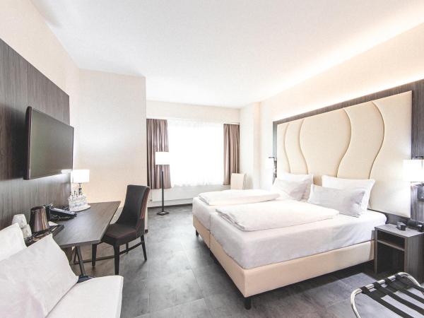 Best Western Plaza Hotel Mannheim : photo 1 de la chambre deluxe quadruple room with one double and two single beds