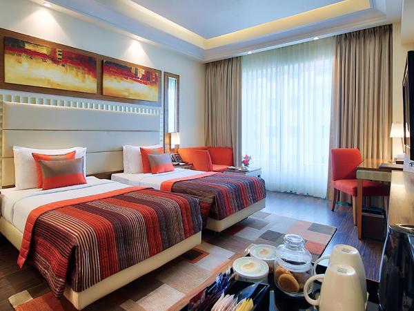 Ramada Gurgaon Central : photo 1 de la chambre executive twin room - non-smoking with happy hours (1+1 ;only applicable for imfl not all the brand at the bar)