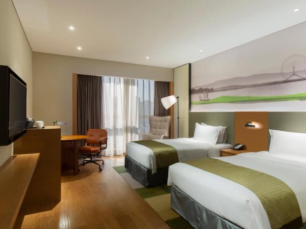 Holiday Inn & Suites Tianjin Downtown, an IHG Hotel : photo 2 de la chambre chambre king standard avec vue sur ville