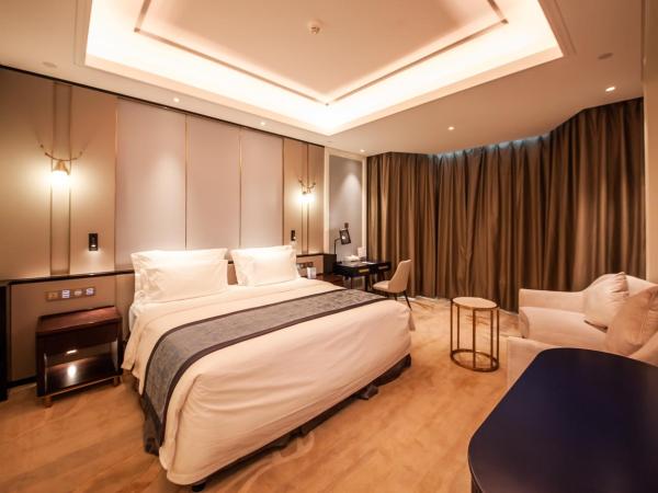 Wyndham Qingdao : photo 3 de la chambre elegant family suite with 2 king bed rooms