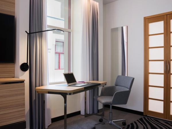 Novotel Den Haag City Centre : photo 3 de la chambre suite supérieure avec canapé