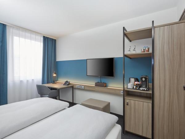 H4 Hotel Leipzig : photo 6 de la chambre chambre double ou lits jumeaux confort 