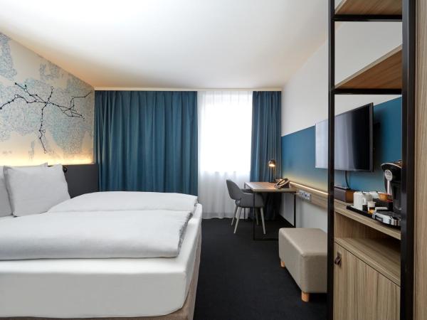H4 Hotel Leipzig : photo 2 de la chambre chambre double ou lits jumeaux affaires 