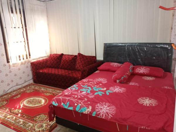 Mayestik Guest House Syariah : photo 4 de la chambre suite deluxe avec lit king-size