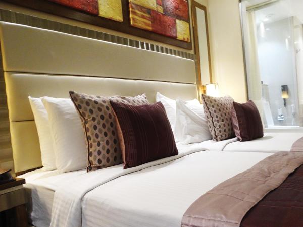 Ramada Gurgaon Central : photo 3 de la chambre club twin room - non-smoking with happy hours (1+1;only applicable for imfl not all the brand at the bar),15% discount on f&b,inr 500 spa credit, early check-in for 03 hours and late checkout for 03 hours