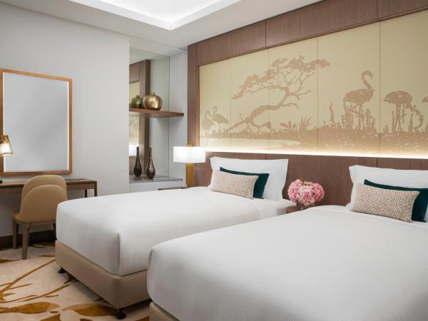 Al Jaddaf Rotana Suite Hotel : photo 1 de la chambre chambre lits jumeaux - vue sur ville