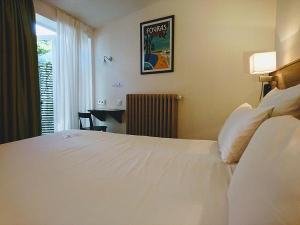 Accostage Hôtel Plage de la Concurrence : photo 4 de la chambre chambre double ou lits jumeaux avec patio