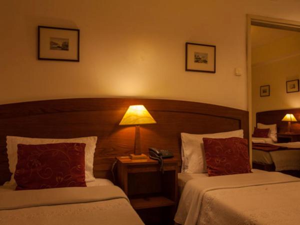 Vera Cruz Porto Downtown Hotel : photo 2 de la chambre chambre triple