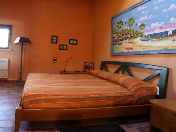 La Puraza Comfort Rooms : photo 4 de la chambre chambre lit queen-size - vue sur jardin