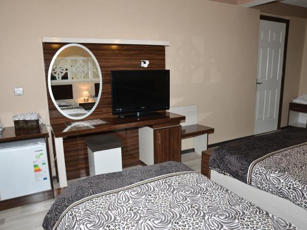 Ozbay Hotel : photo 4 de la chambre chambre triple deluxe avec balcon