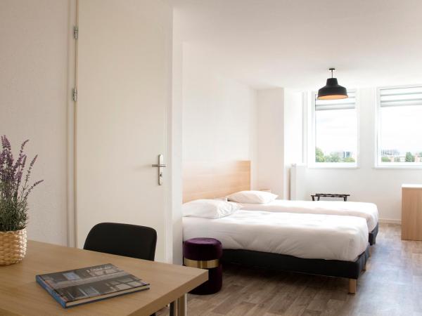 Résidence La Canopée : photo 1 de la chambre studio - chambre lits jumeaux
