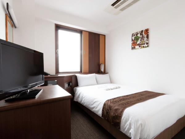 Toyo Hotel : photo 2 de la chambre chambre double avec petit lit double - non-fumeurs