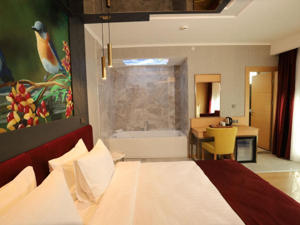 MY GARDEN SUITES : photo 1 de la chambre chambre double deluxe avec baignoire