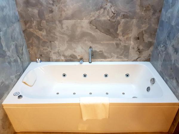 MY GARDEN SUITES : photo 2 de la chambre chambre double deluxe avec baignoire